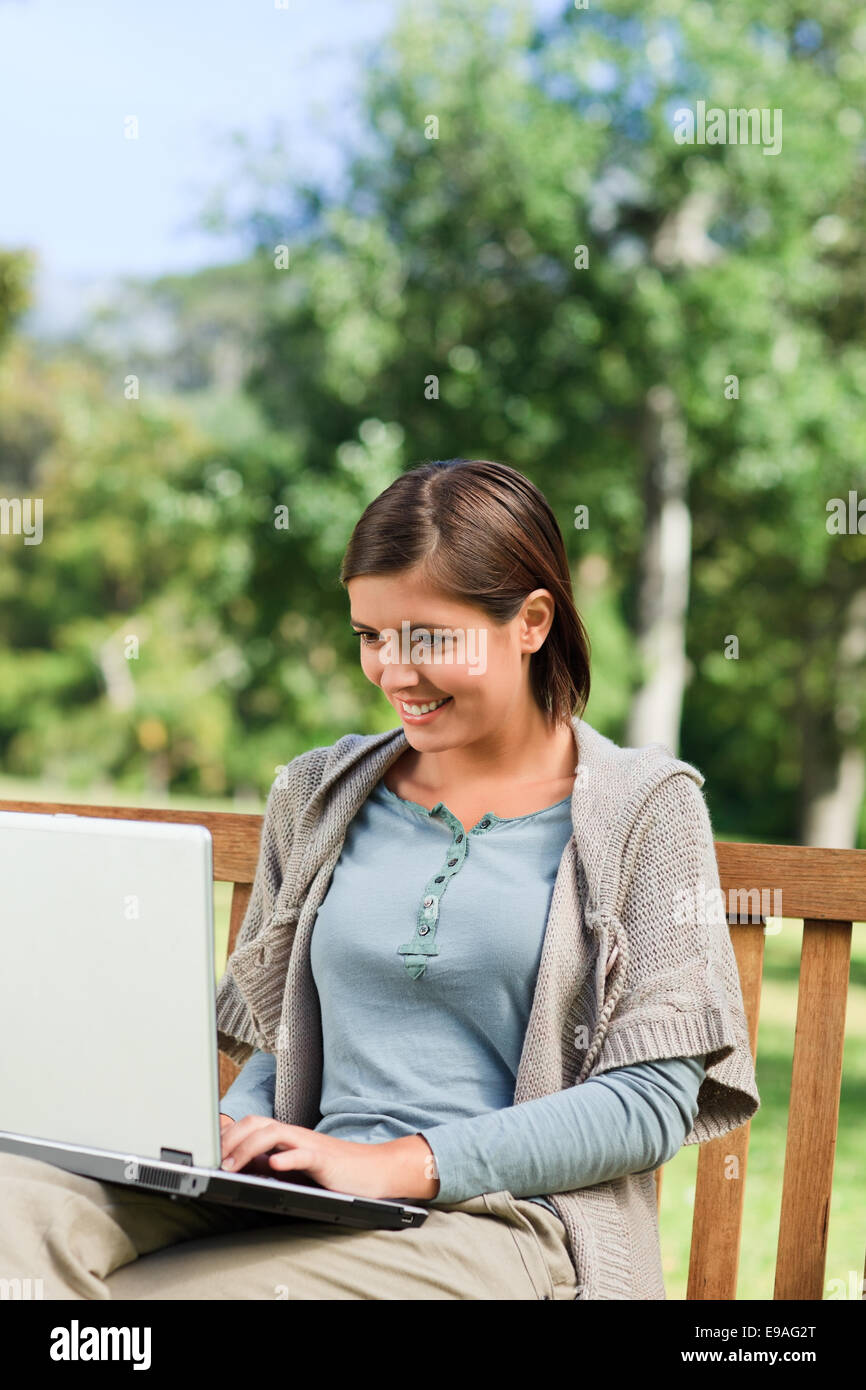Young woman working on her laptop Stock Photo - Alamy