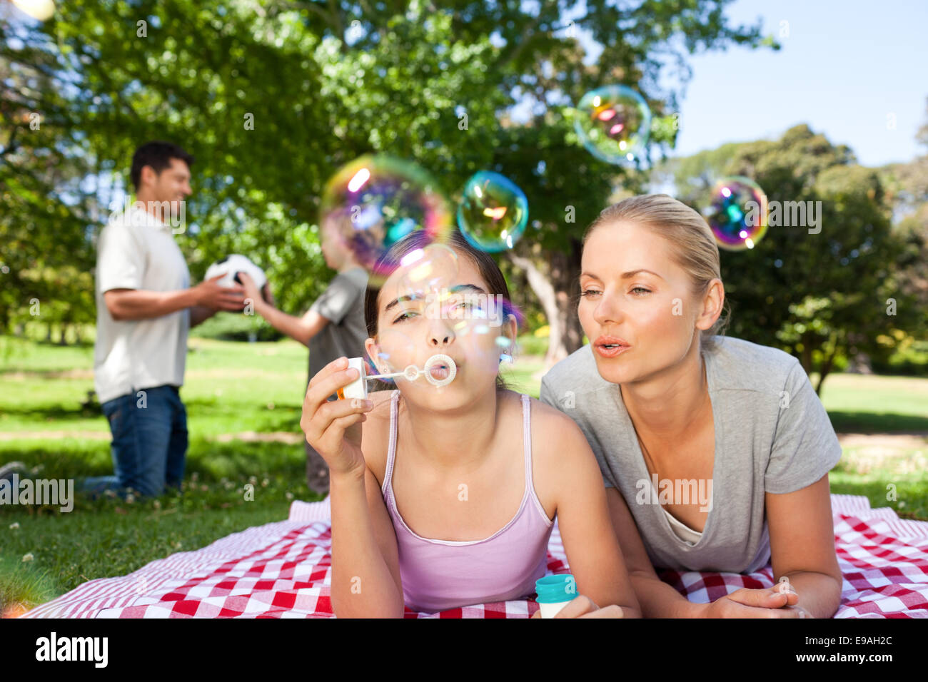 Mother and daughter having fun in the park Stock Photo - Alamy