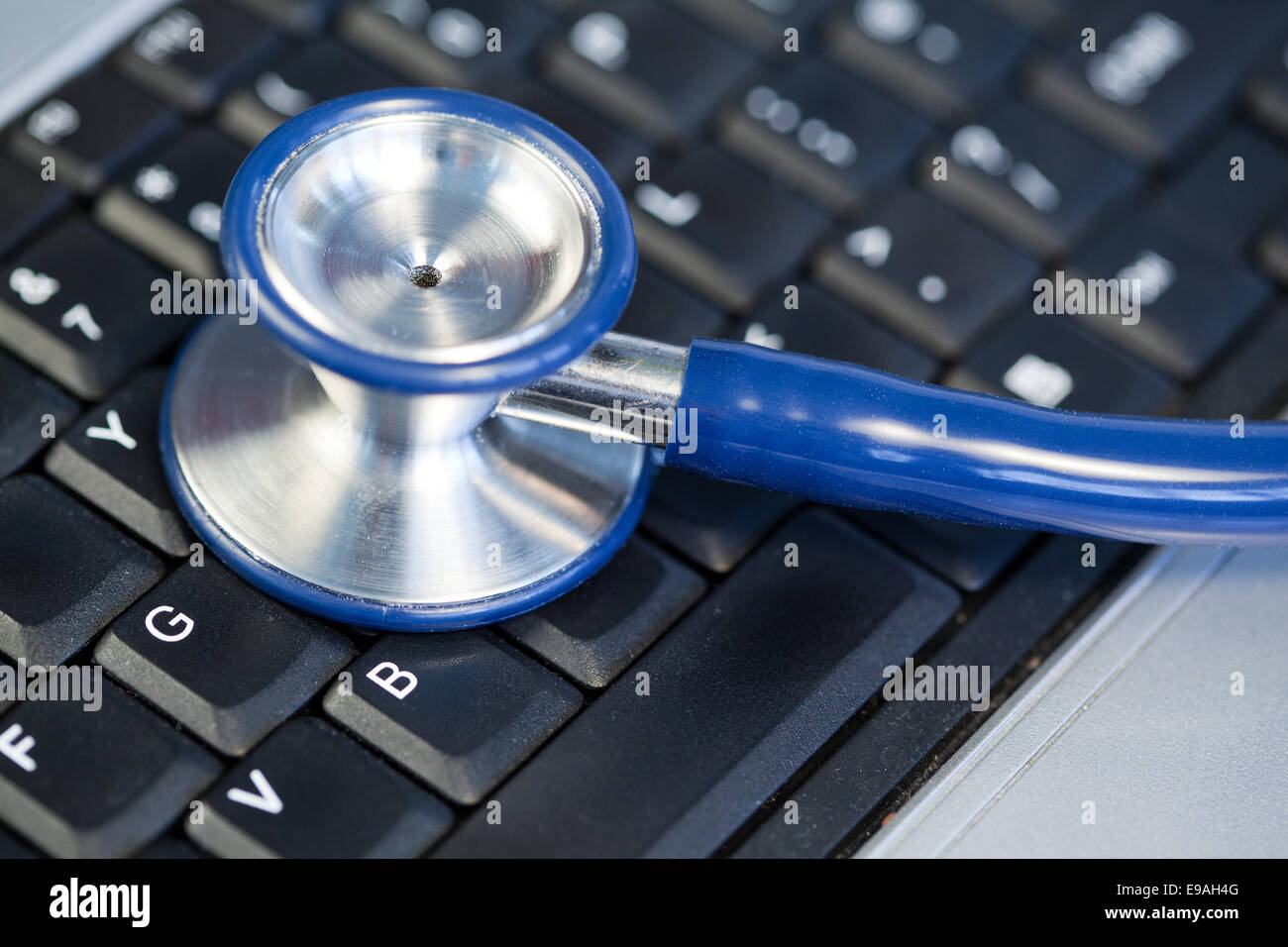 Blue angled stethoscope on keyboard Stock Photo - Alamy