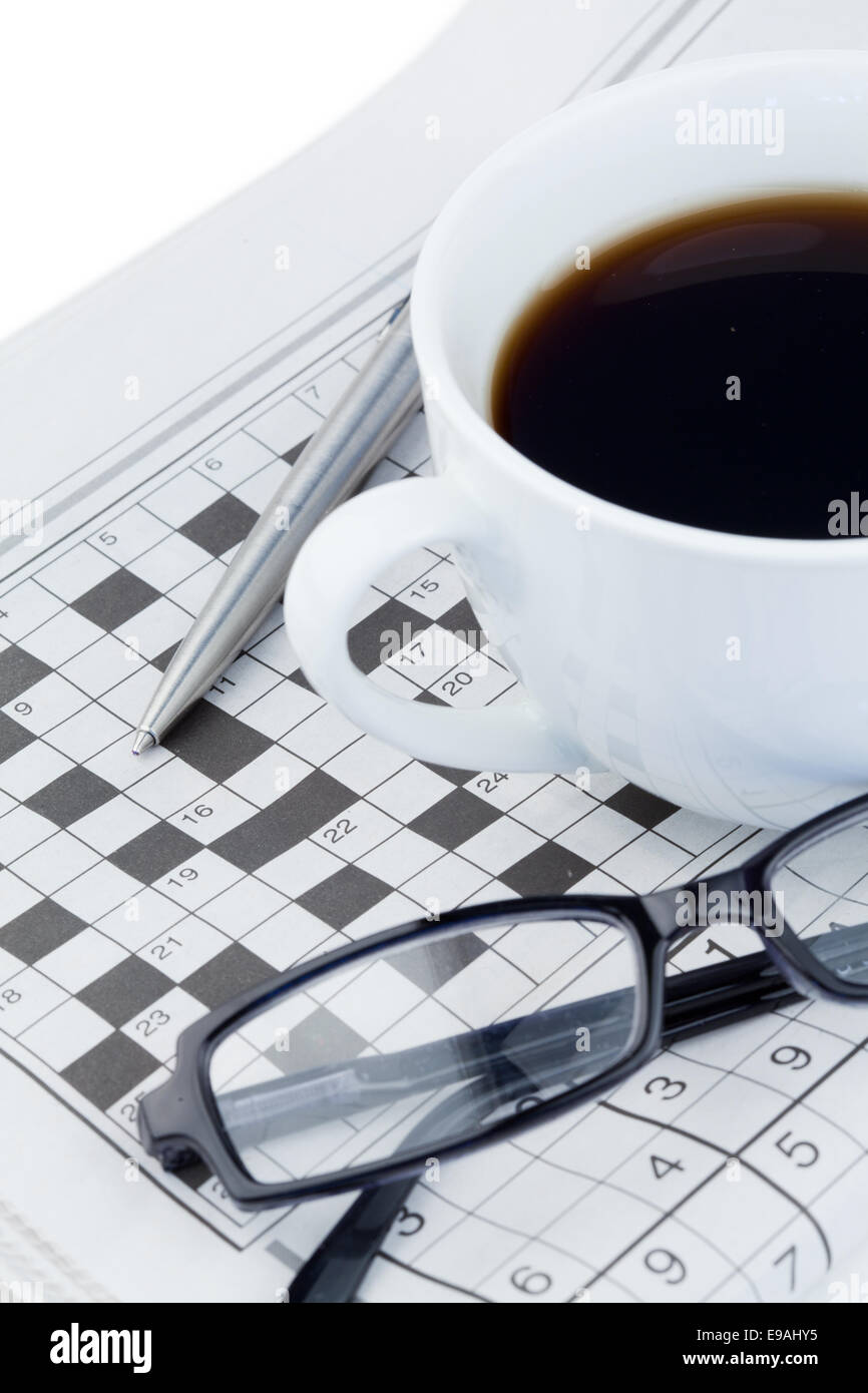 Newspapers and crossword puzzle Stock Photo - Alamy