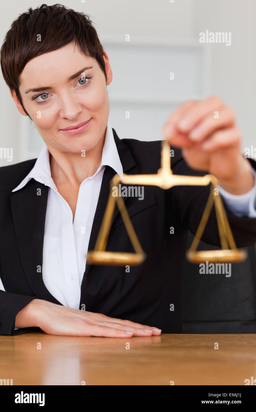 Woman holding the justice scale Stock Photo