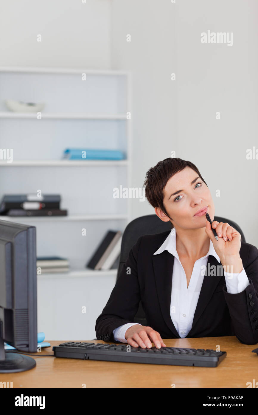 Portrait of a thoughtful secretary Stock Photo - Alamy