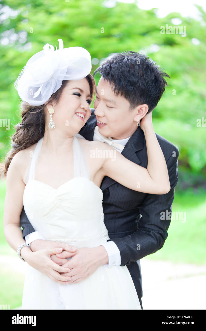 Newlyweds Couples kissing Stock Photo