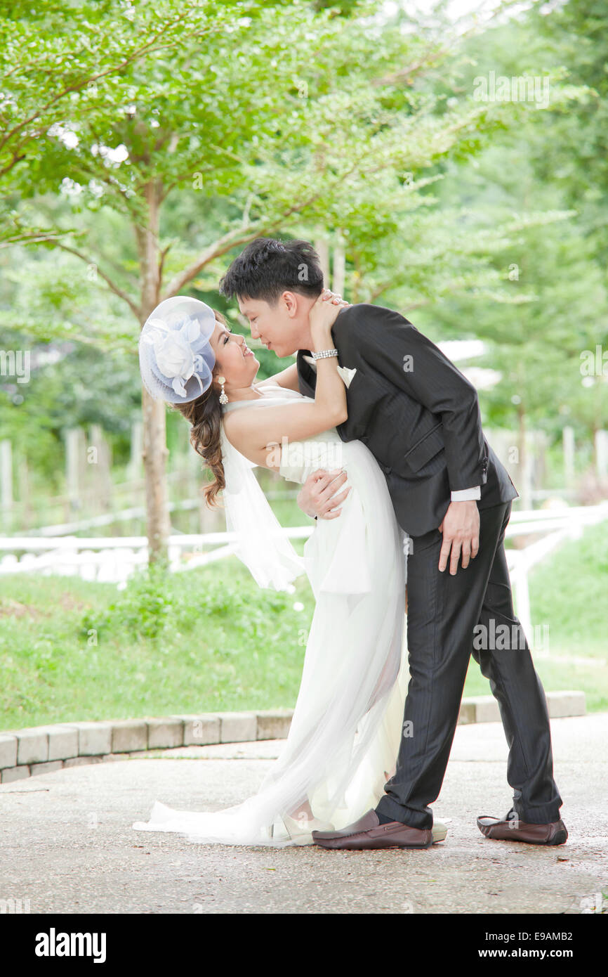 Romantic Newlyweds Couples kissing Stock Photo