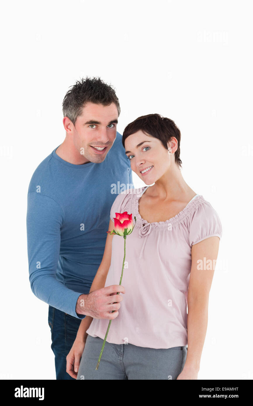 Offeing Roses Man offering a rose to his wife Stock Photo - Alamy