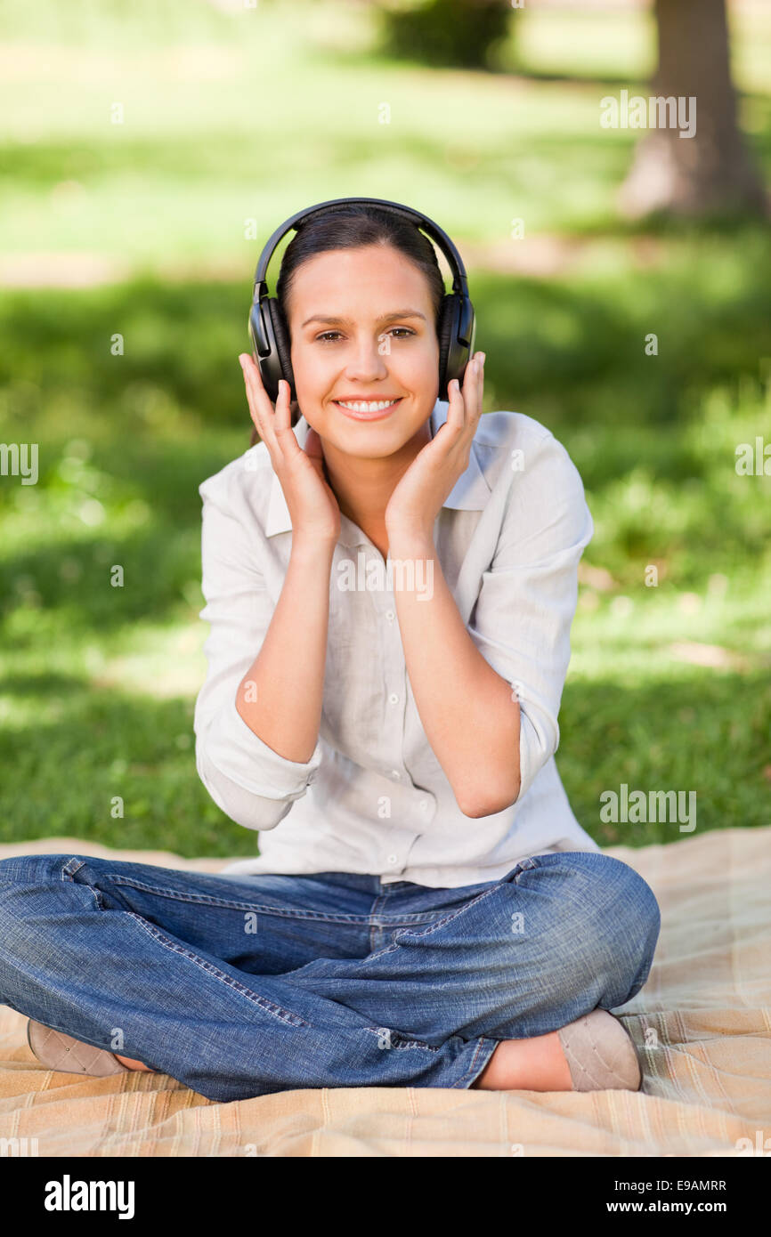 Happy young woman listening to music Stock Photo - Alamy