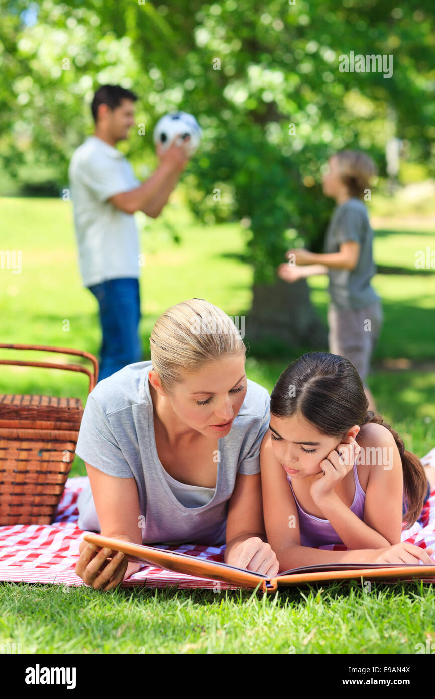 Happy family picnicking in the park Stock Photo - Alamy
