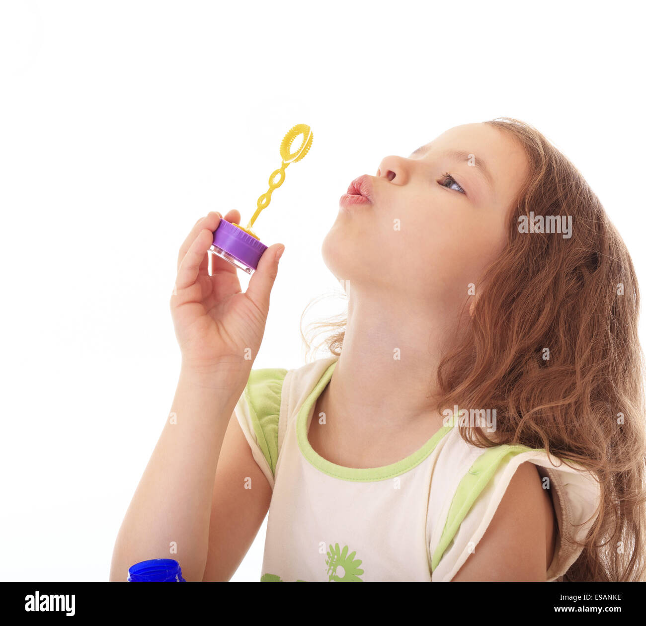Beautiful little girl blow bubbles. Stock Photo