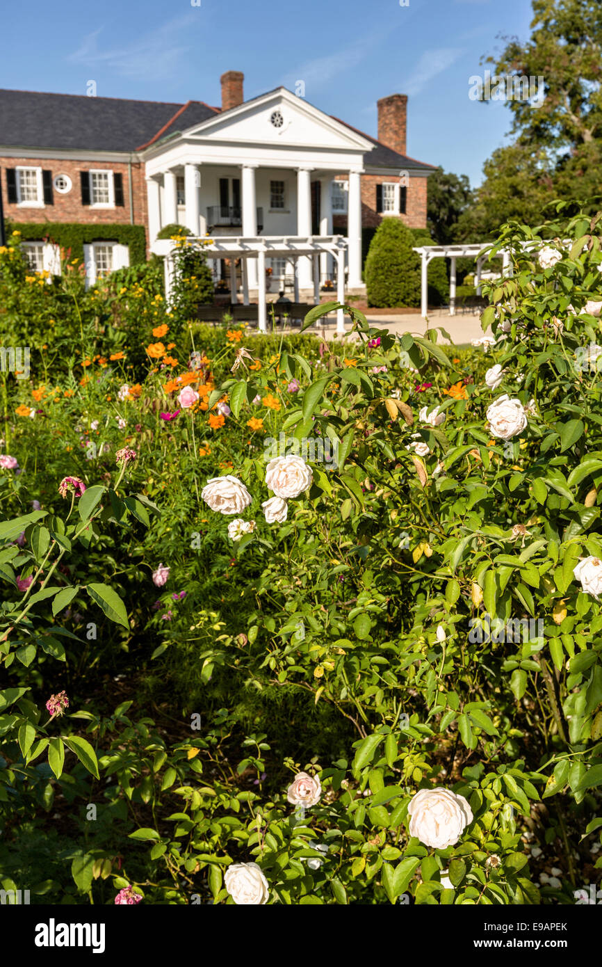 The Colonial Revival plantation house surrounded by English gardens at