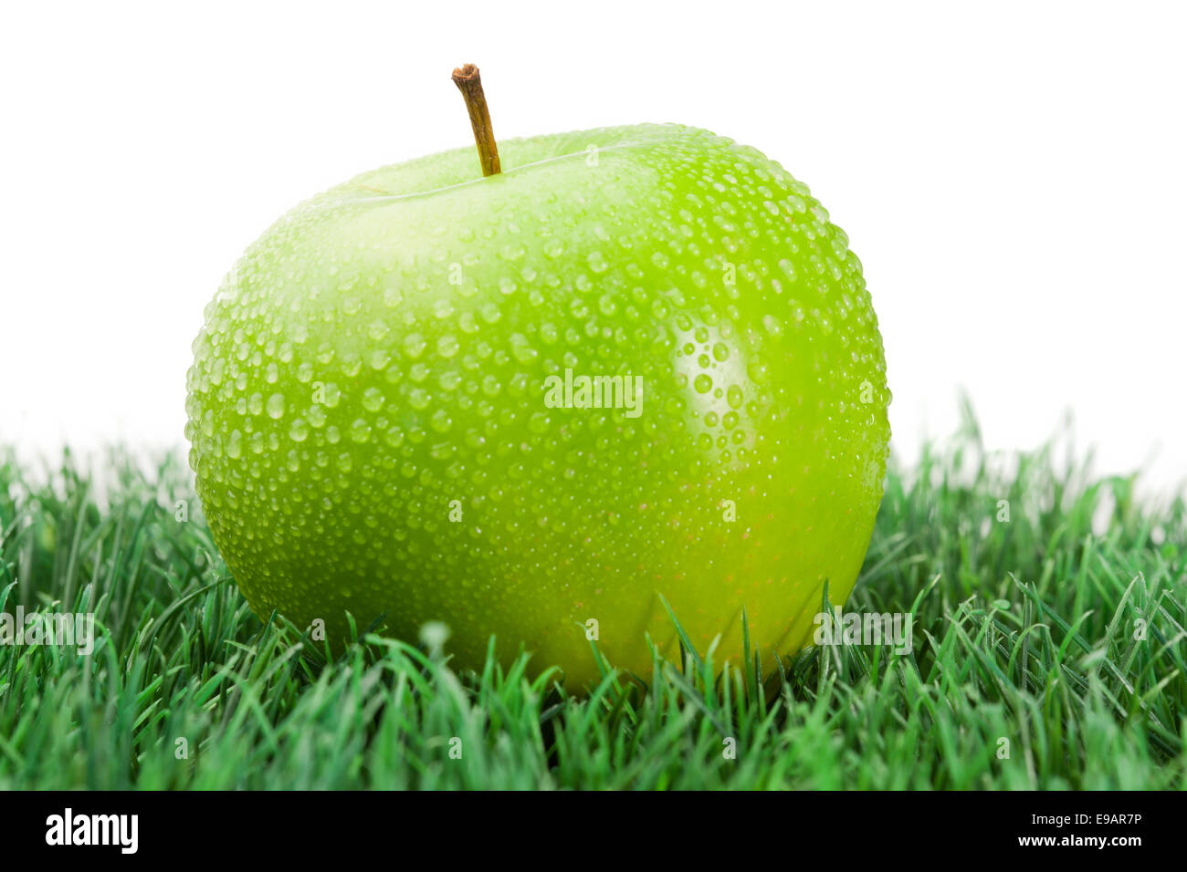 Fresh apple wet on grass hi-res stock photography and images - Alamy