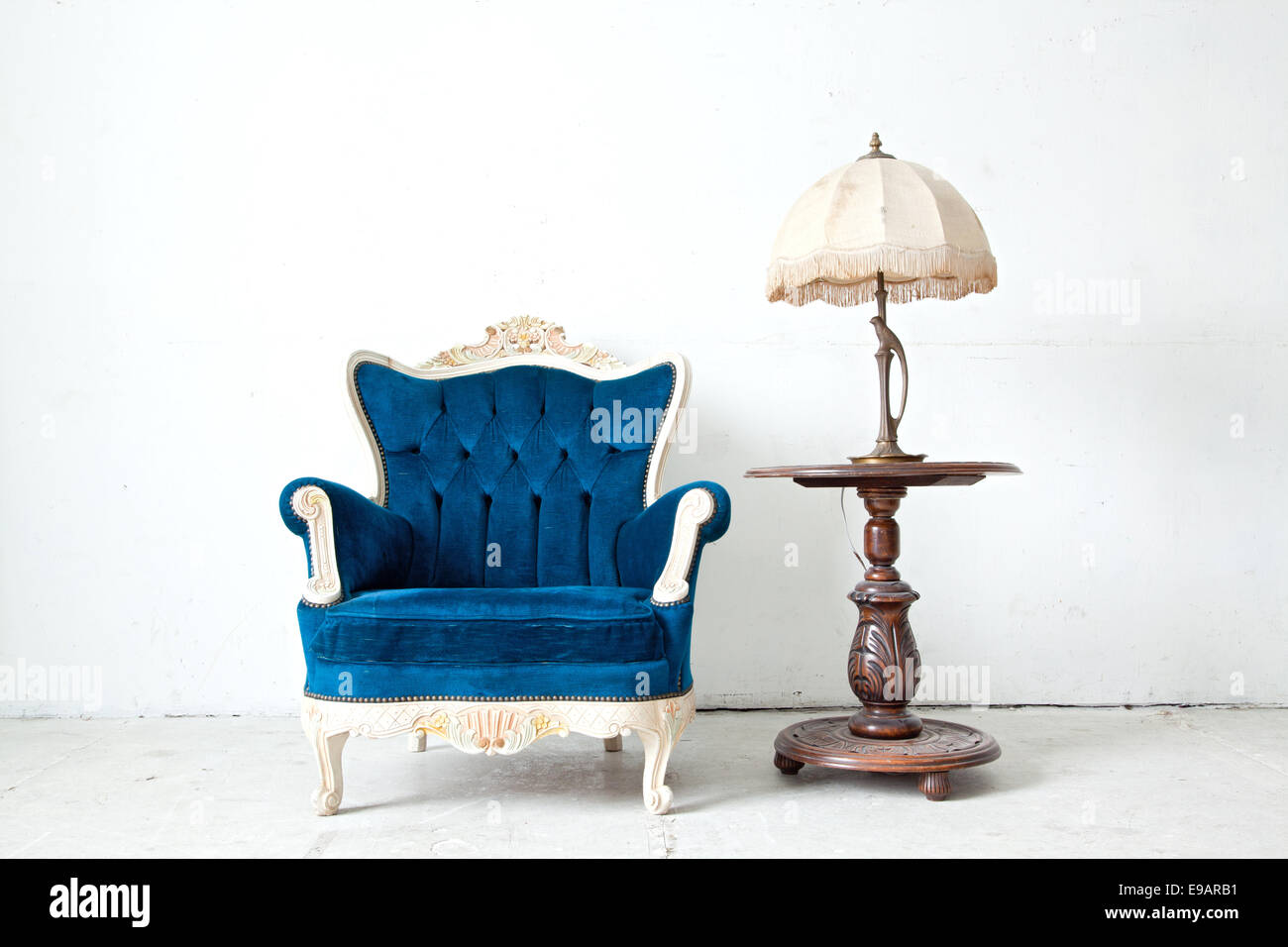 Armchair with desk lamp in vintage room Stock Photo - Alamy