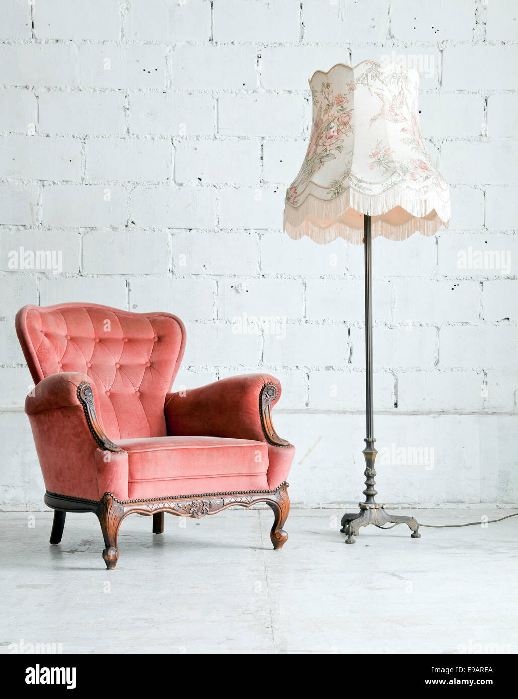 Armchair with desk lamp in vintage room Stock Photo - Alamy