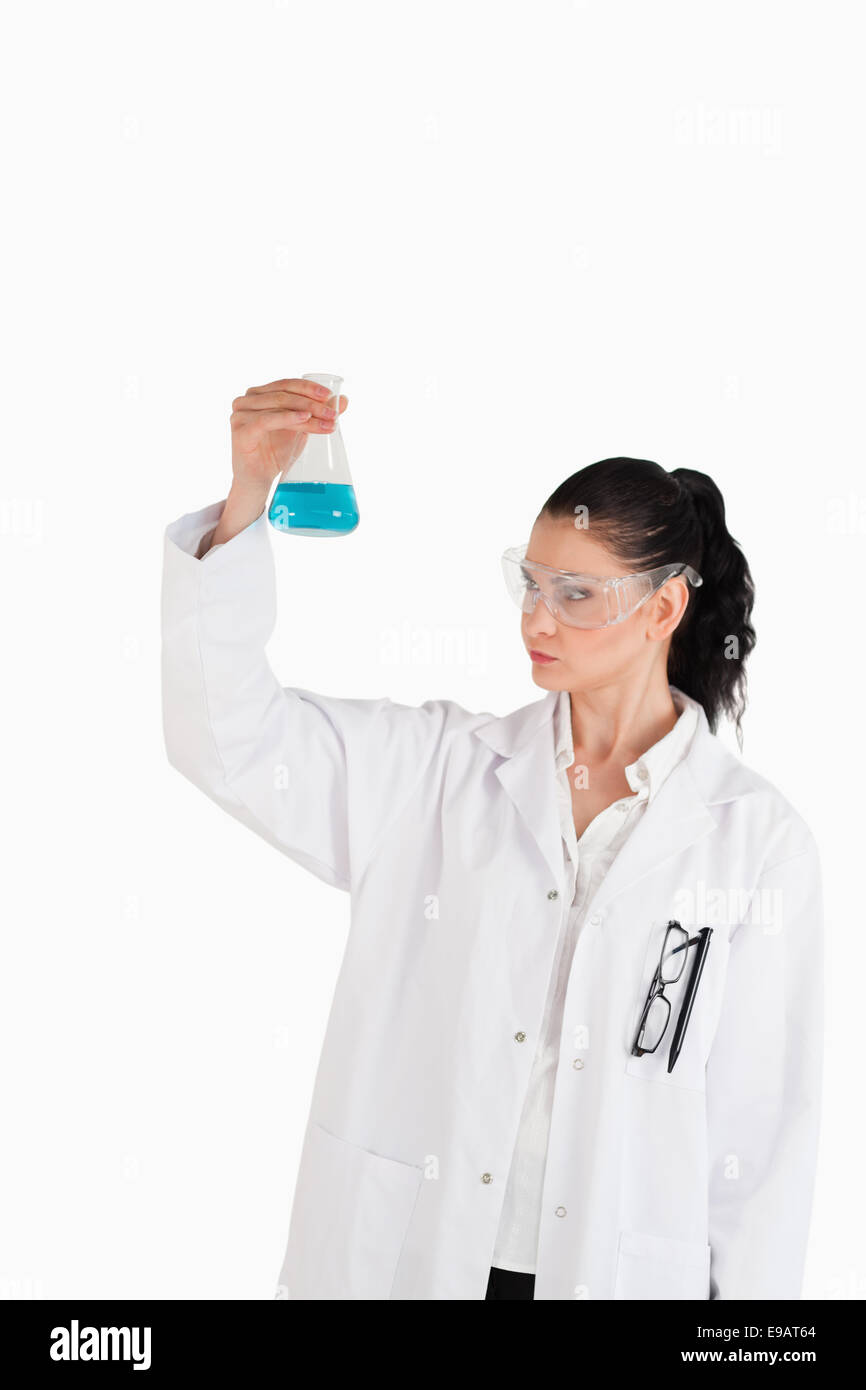 Dark-haired woman carrying out an experiment Stock Photo
