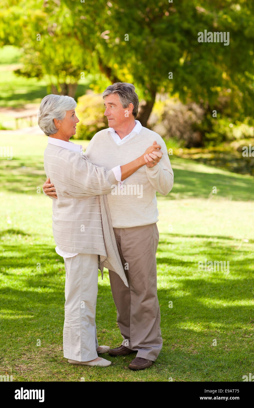 Senior couple dancing in the park Stock Photo - Alamy