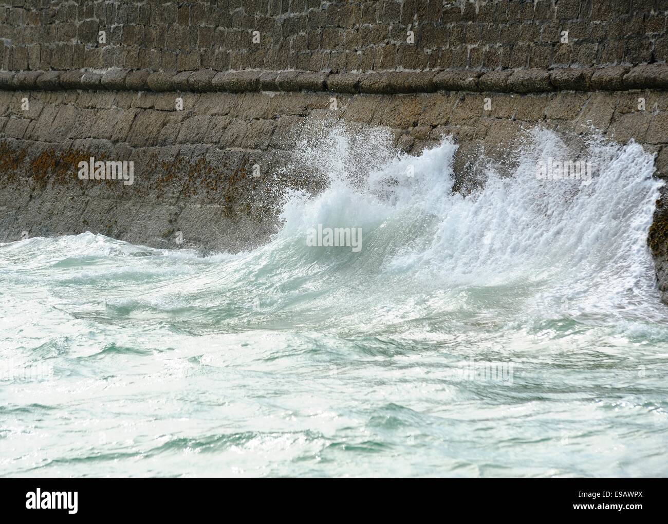 Waves crashing on the sea wall St Ives Cornwall England uk Stock Photo