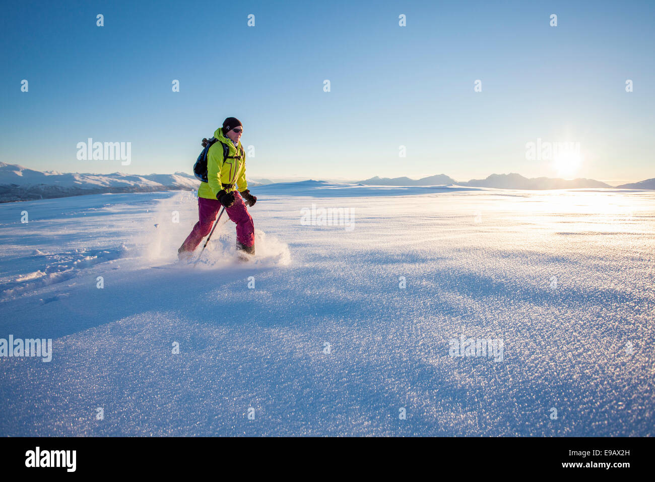 Snowshoe walker on Rodtinden, Kvaloya, Tromso, Troms, Norway Stock Photo