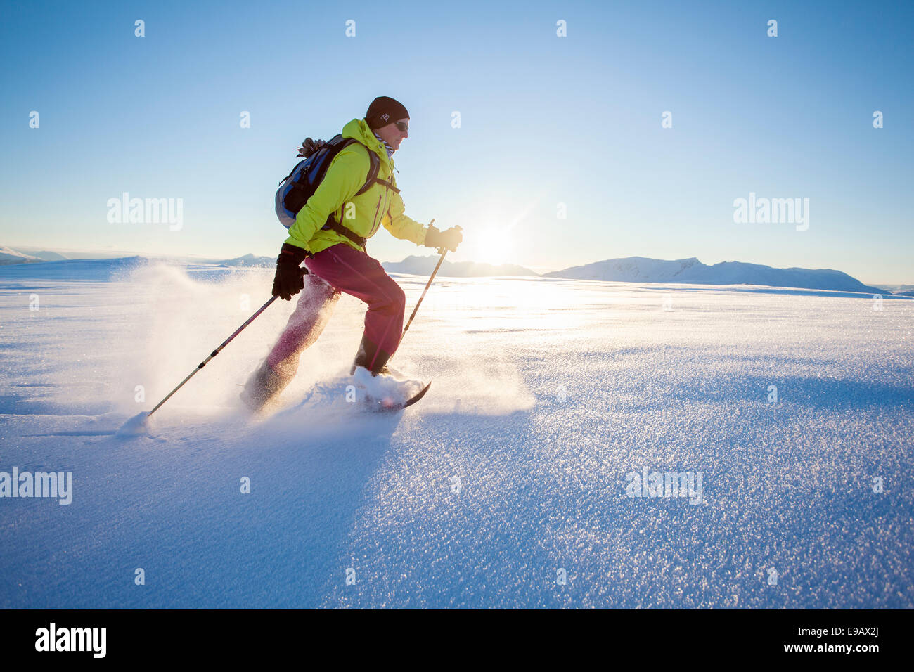 Snowshoe walker on Rodtinden, Kvaloya, Tromso, Troms, Norway Stock Photo -  Alamy