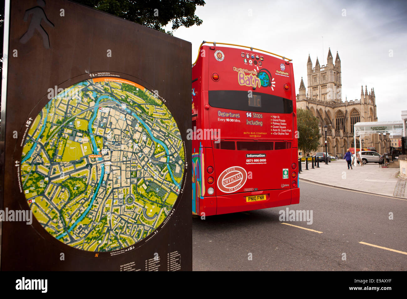 UK, England, Wiltshire, Bath, red open topped sightseeing bus and tourist map at the Abbey Stock Photo