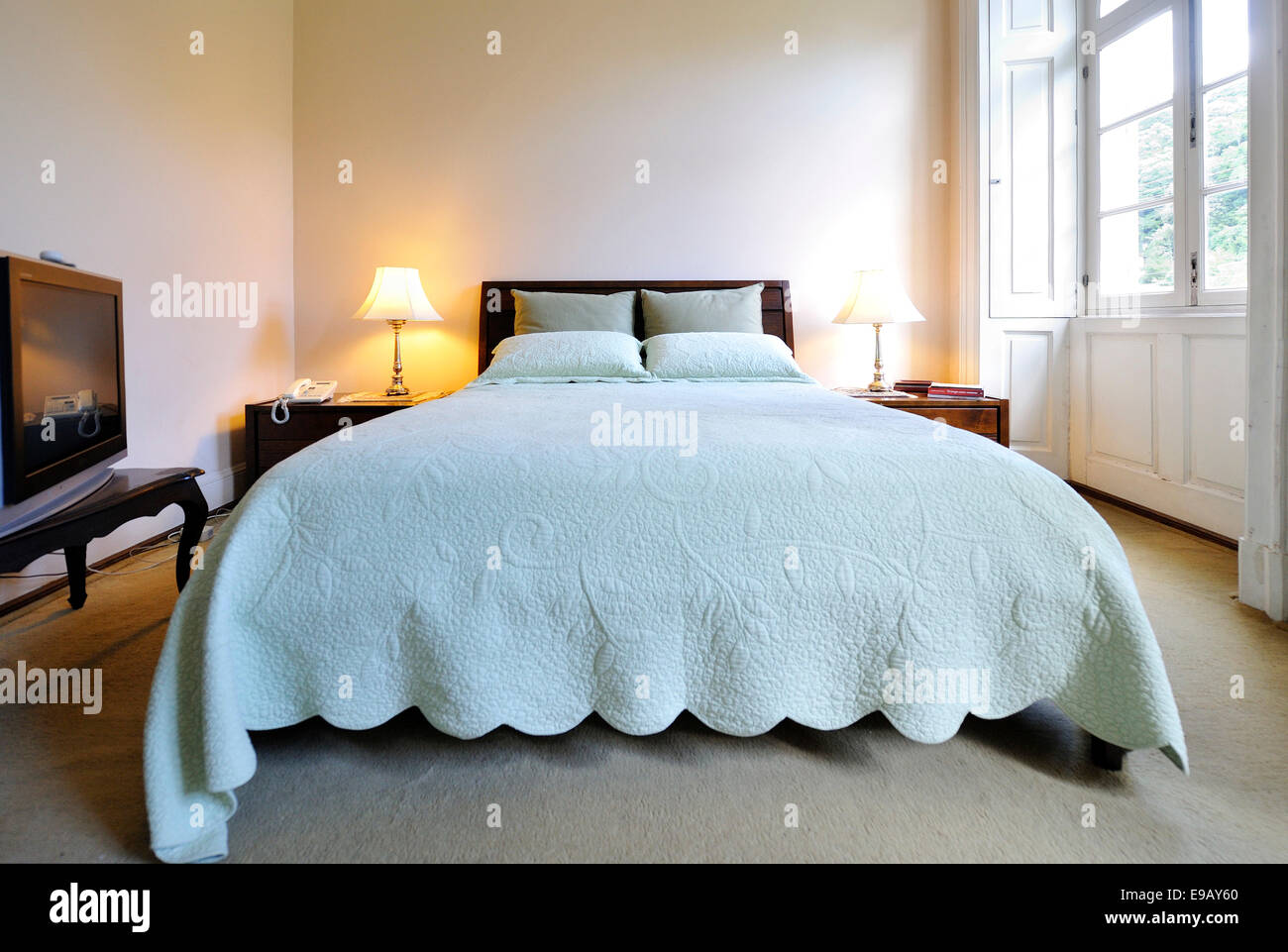 Double bed in a bedroom Stock Photo