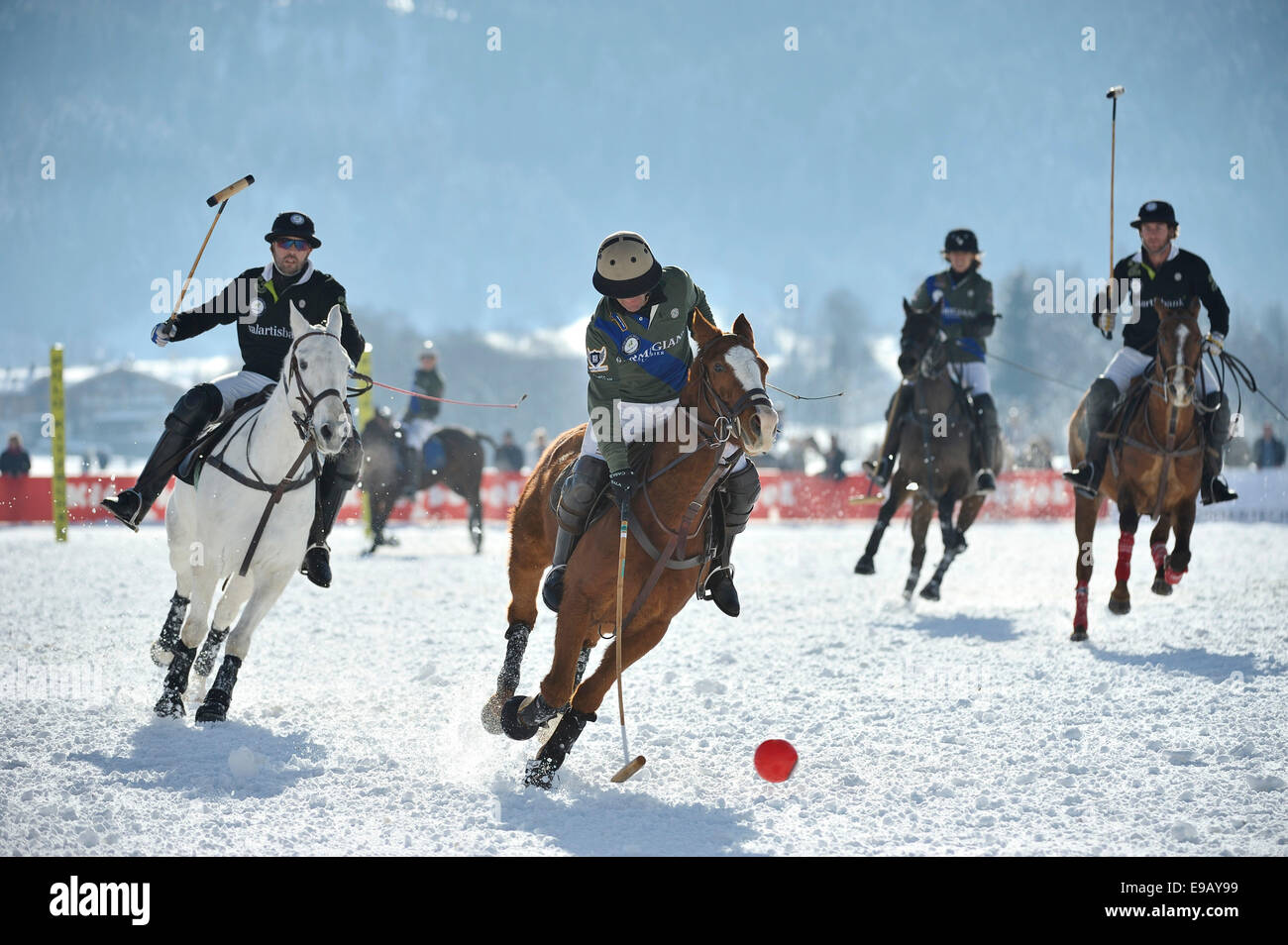 Team Parmigiani, gray, versus Team Valartis Bank, black, Polo on Snow, Polo tournament, 11th Valartis Bank Snow Polo World Cup Stock Photo