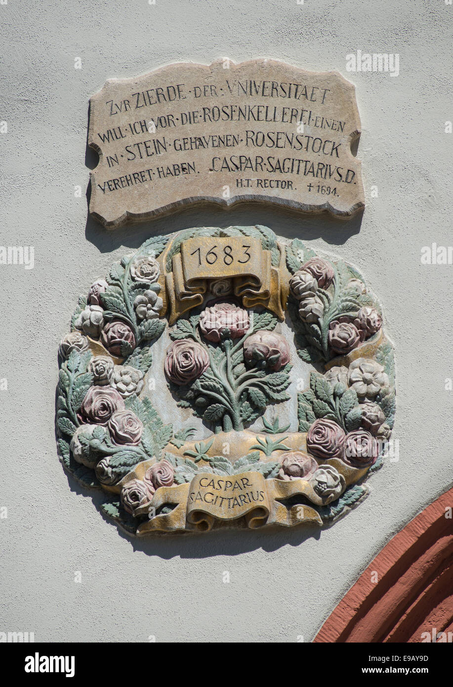 Stone relief at the Gasthof Zur Rose, wreath with roses and date, above a stone tablet with the inscription of the founder Stock Photo