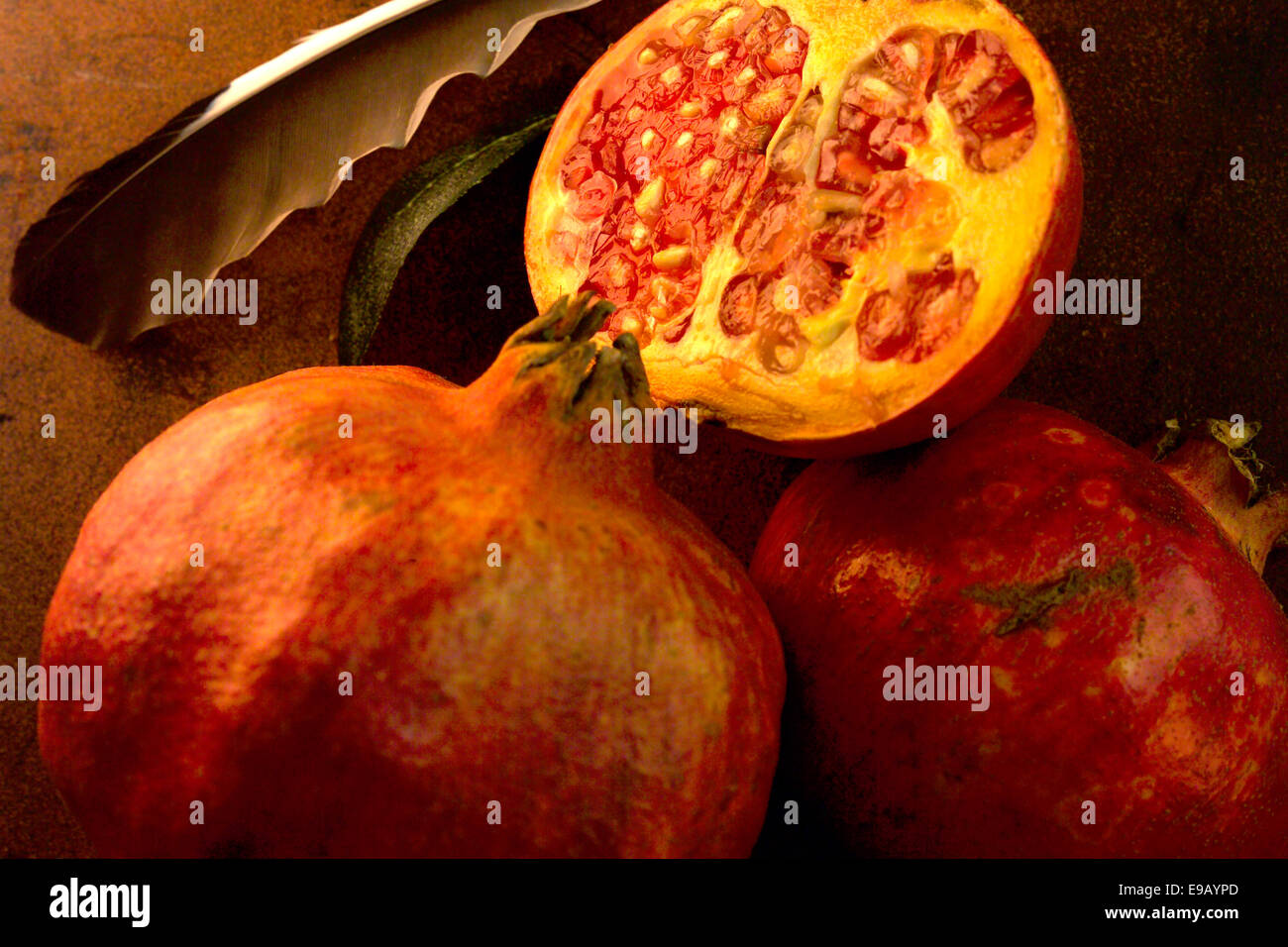 Pomegranates, whole and half fruits Stock Photo