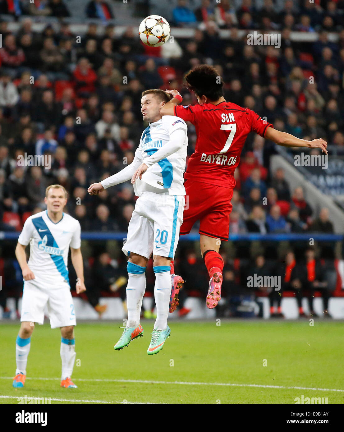 Leverkusen, Germany. 22nd Oct, 2014. Petersburg's Viktor Fayzulin (L) against Leverkusen's Heung-Min Son during the Champions League match between Bayer 04 Leverkusen and St. Petersburg, Bayarena in Leverkusen on October 22., 2014. Credit:  dpa picture alliance/Alamy Live News Stock Photo
