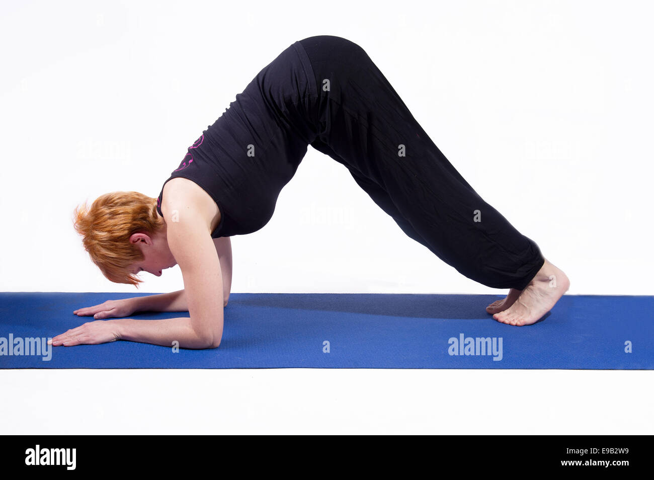 Woman doing sports on exercise mat Stock Photo