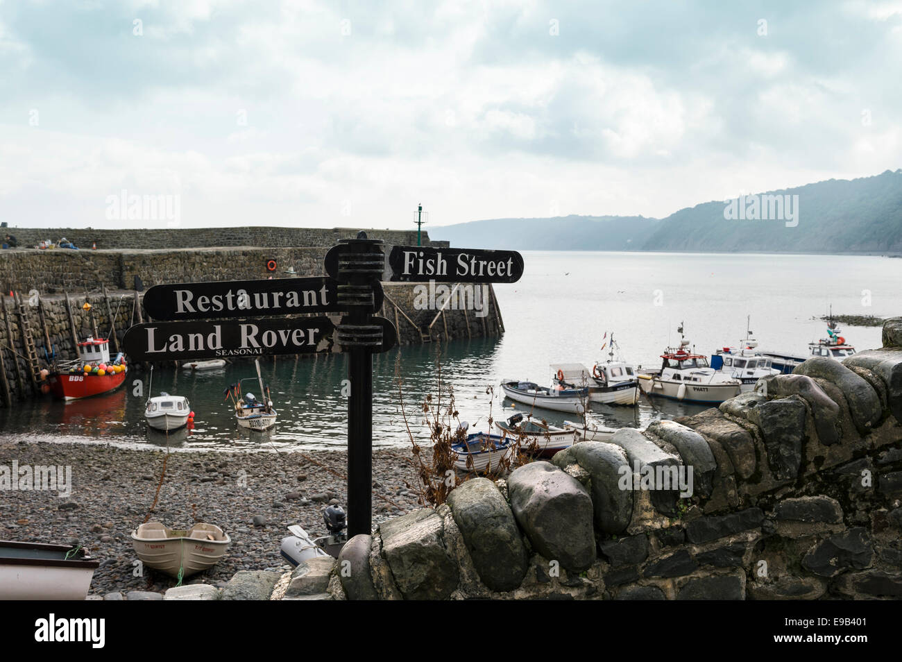Sign for Fish Street, with the sea wall of Clovelly harbour in the background. Stock Photo