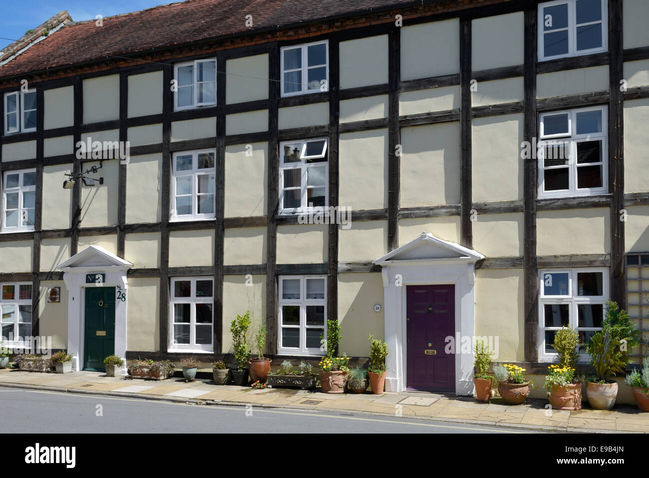 Floral display outside a timber framed house, Lower Broad Street, Ludlow, Shropshire, England