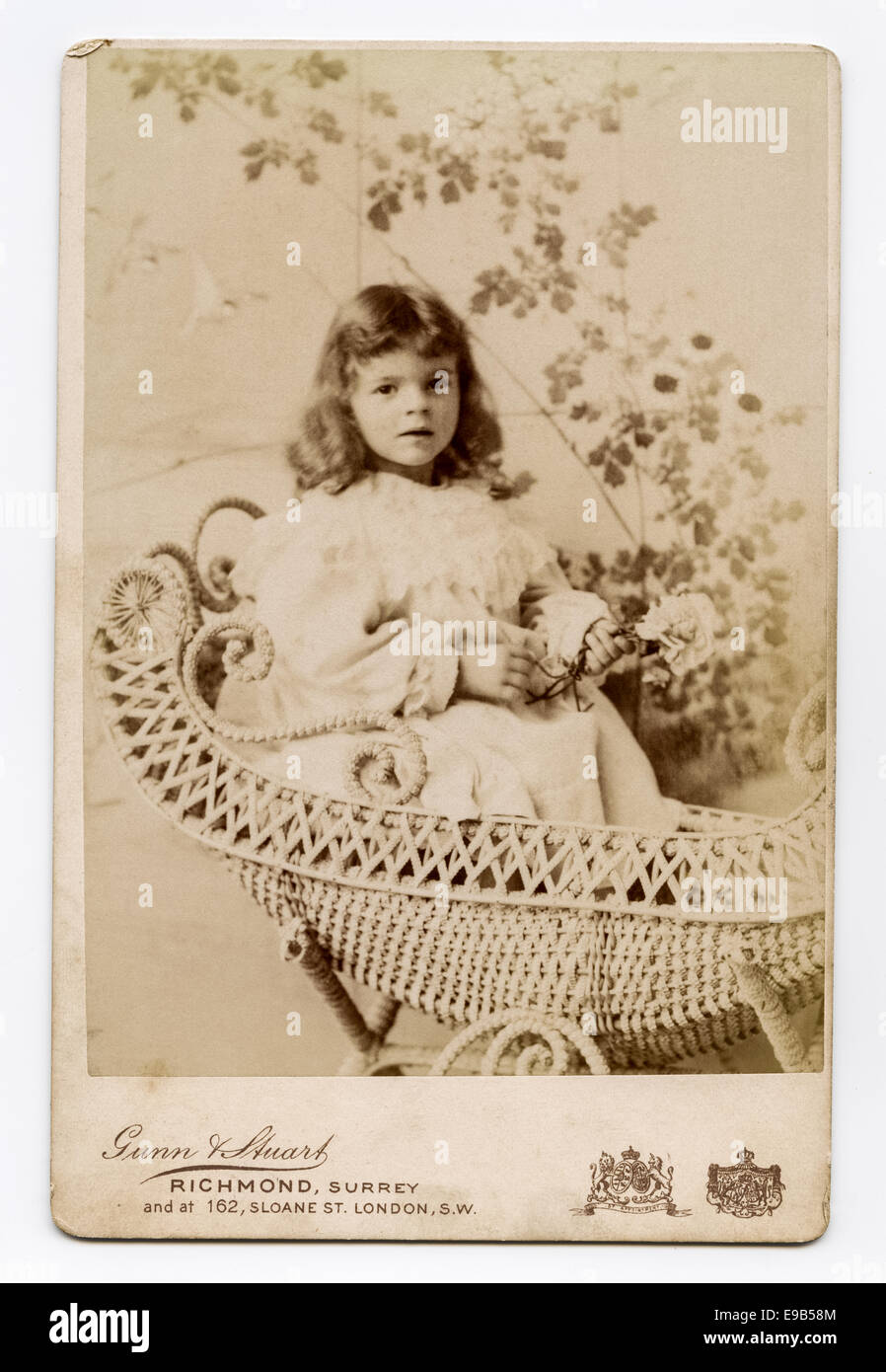 Victorian Cabinet Card studio portrait of young girl from the Gunn & Stuart studio. Taken around 1890 Stock Photo