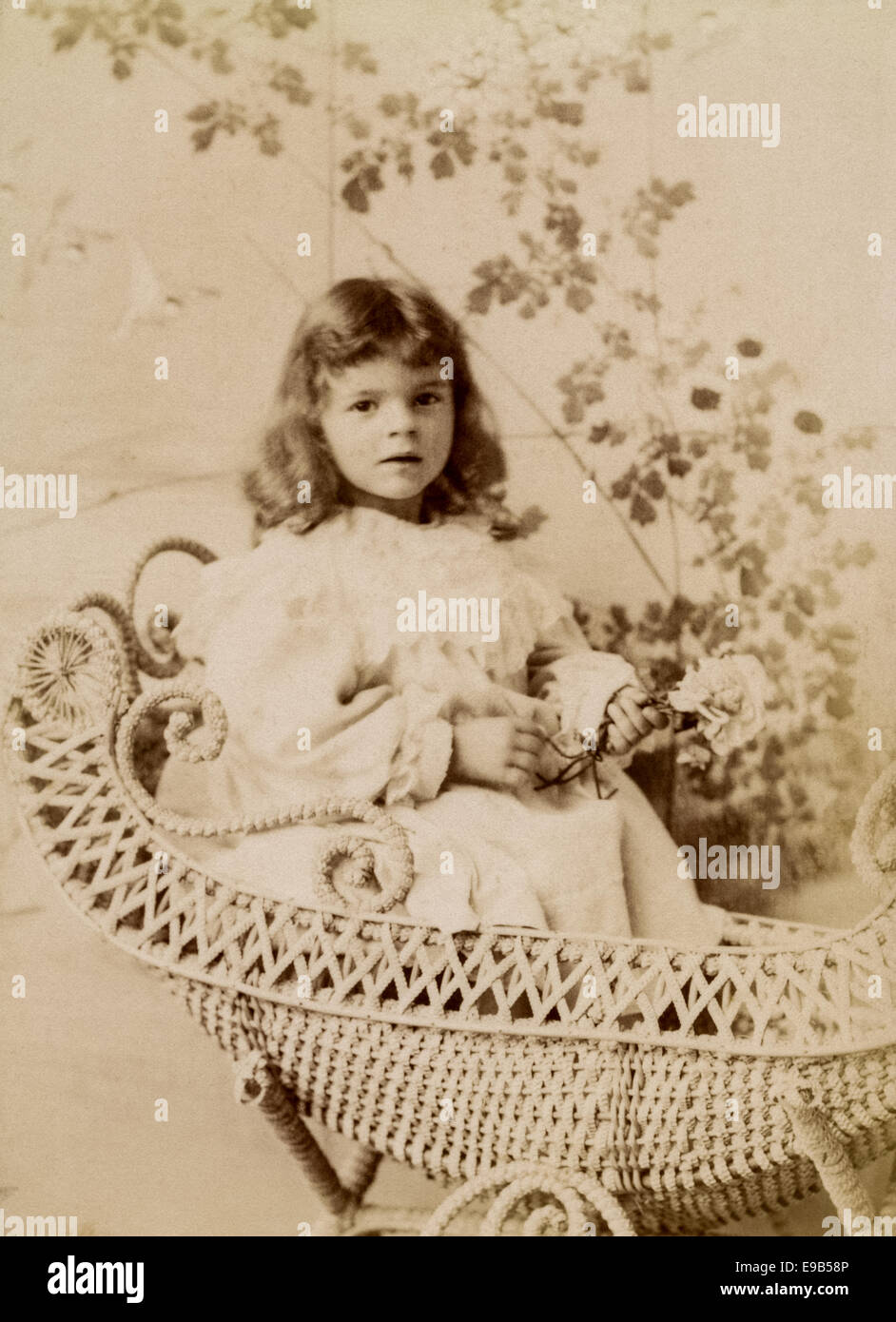 Victorian Cabinet Card studio portrait of young girl from the Gunn & Stuart studio. Taken around 1890 - 1910 Stock Photo