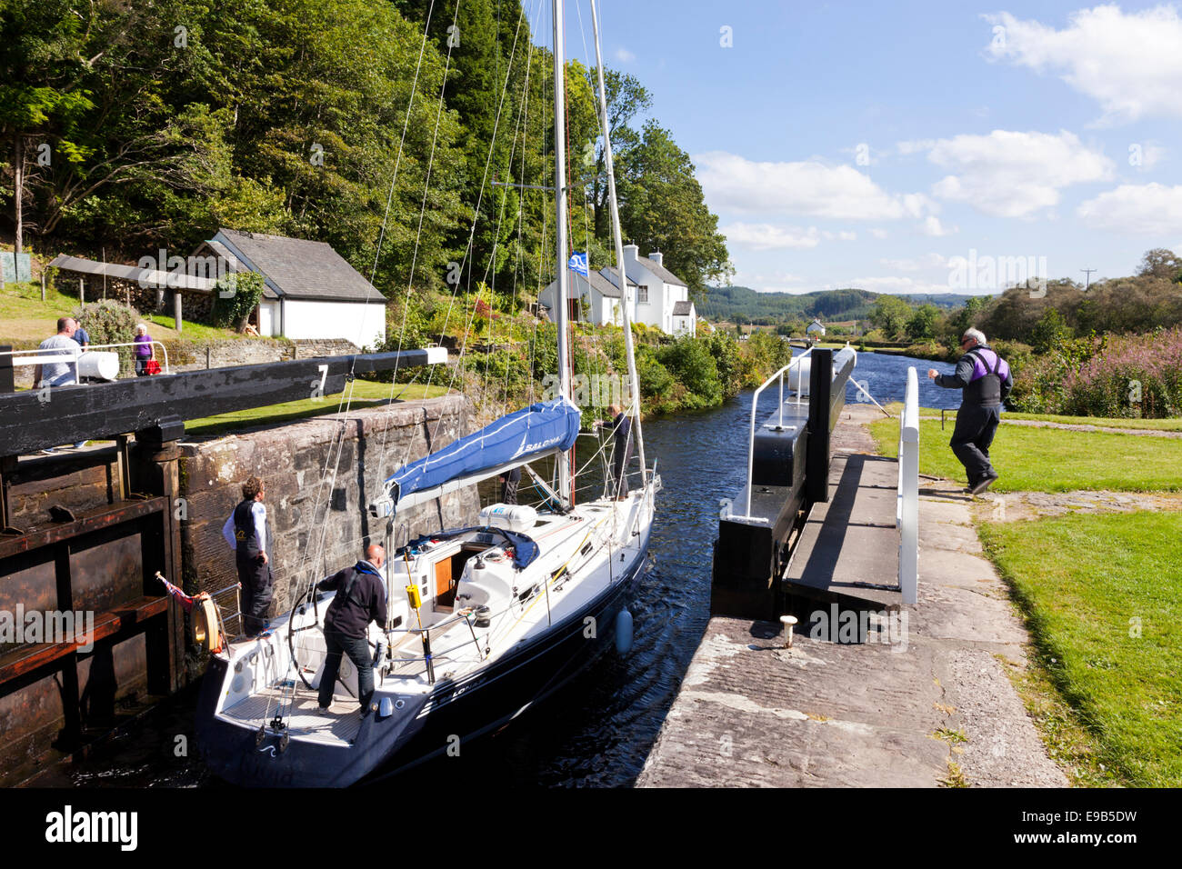 The Crinan Canal - A yacht negotiating Lock 7 at Cairnbaan, Argyll & Bute, Scotland UK Stock Photo