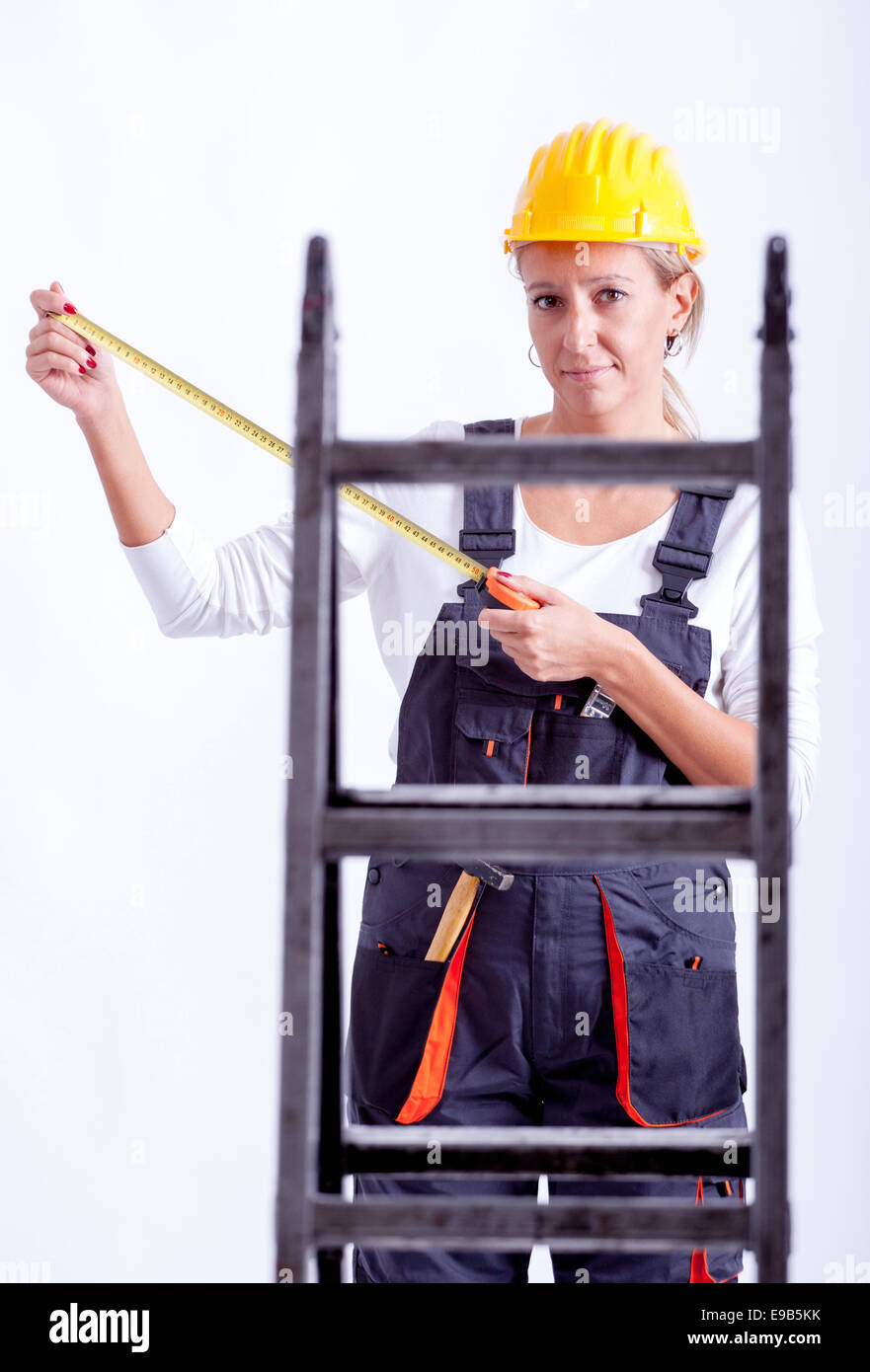 Female construction worker with tools on white background Stock Photo ...