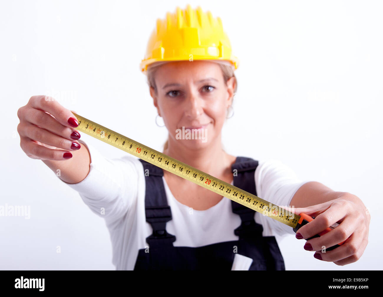 Female construction worker with tools on white background Stock Photo ...