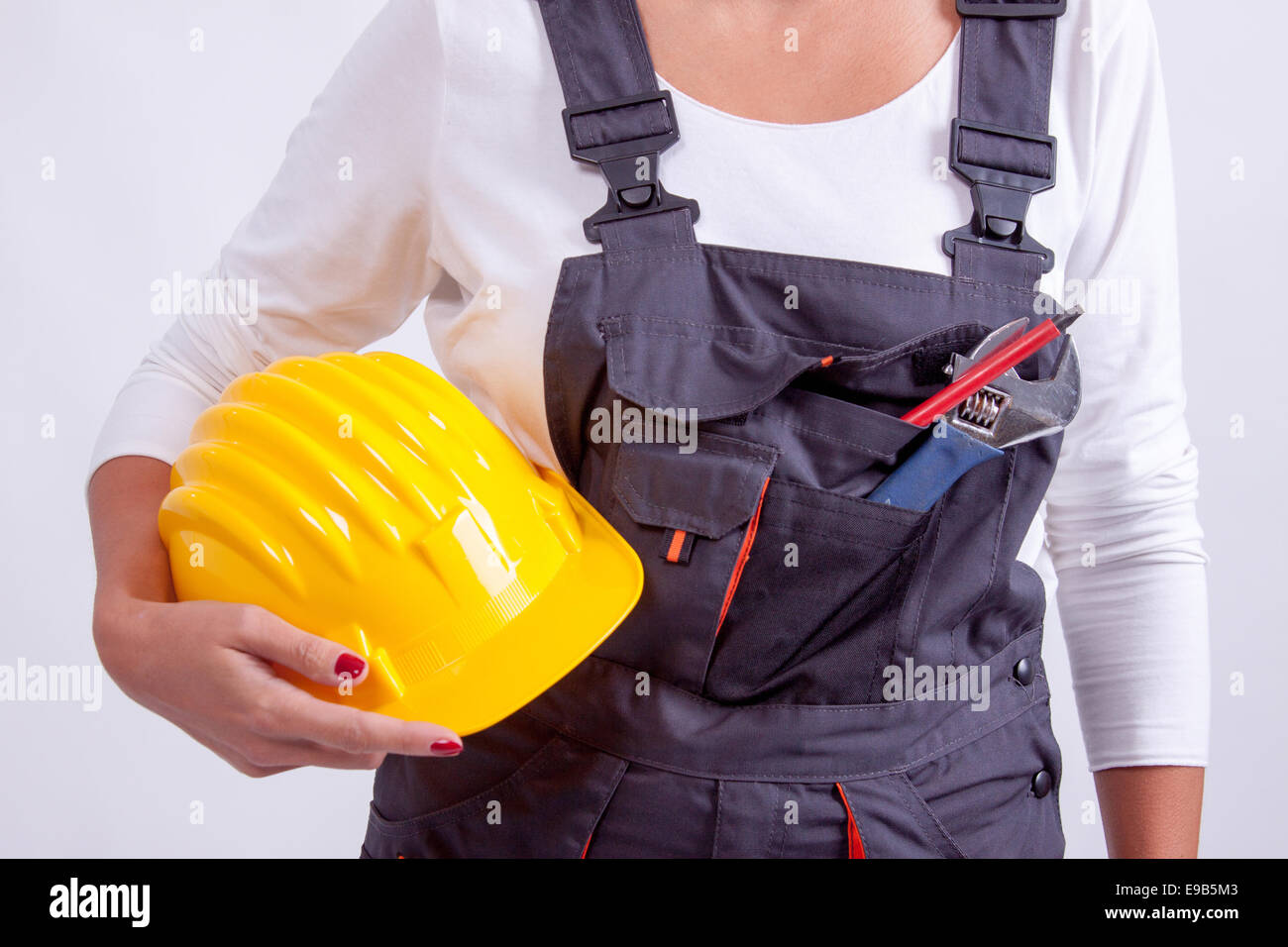 Female construction worker with tools on white background Stock Photo ...