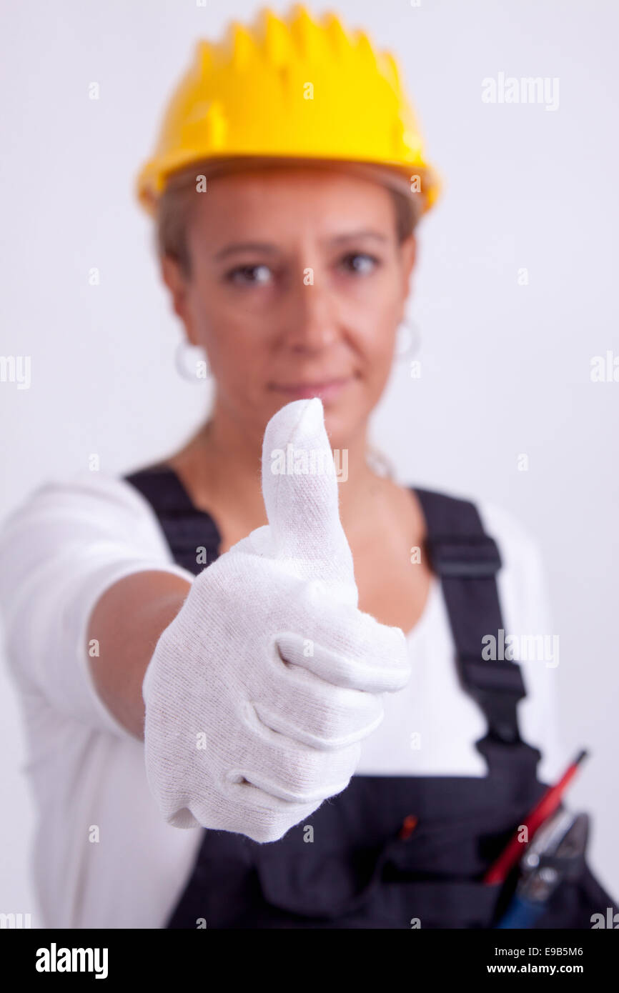 Female construction worker with tools on white background Stock Photo ...