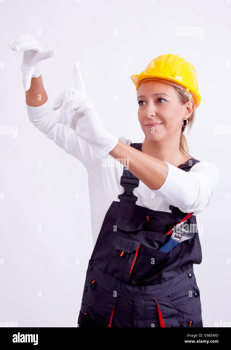 Female construction worker with tools on white background Stock Photo ...