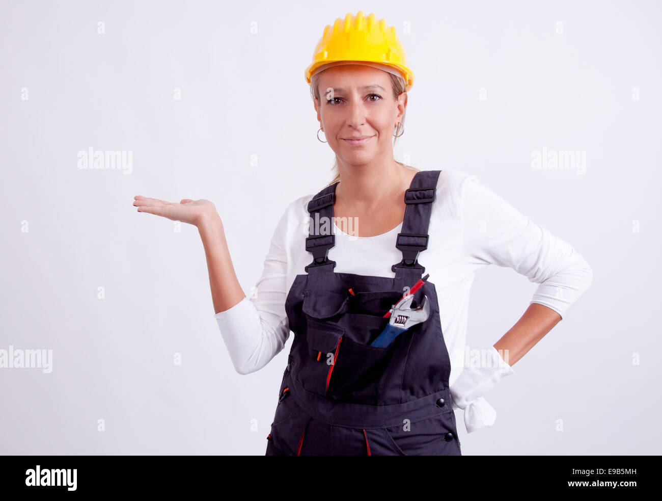 Female construction worker with tools on white background Stock Photo ...