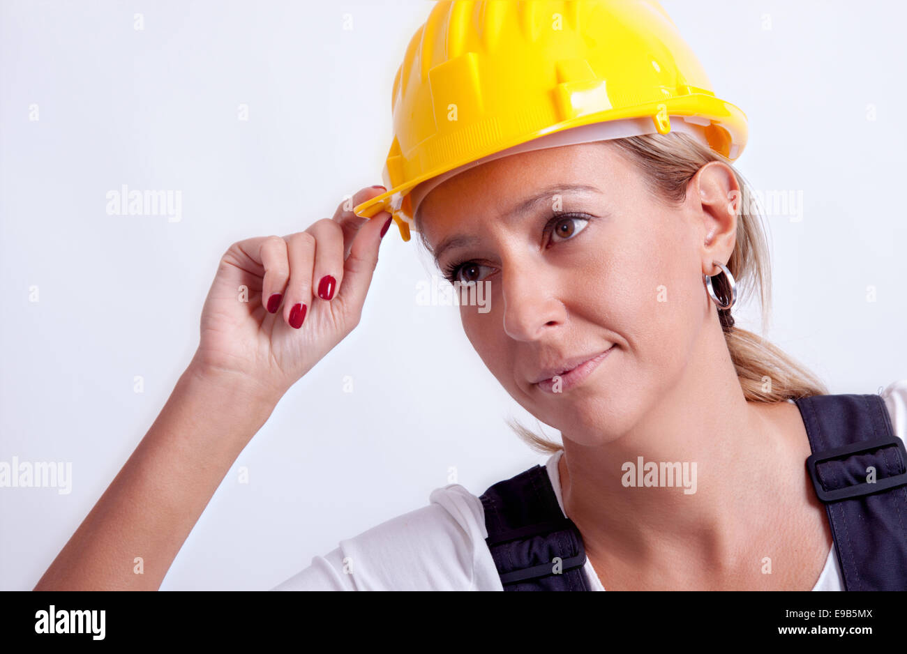 Female construction worker with tools on white background Stock Photo ...