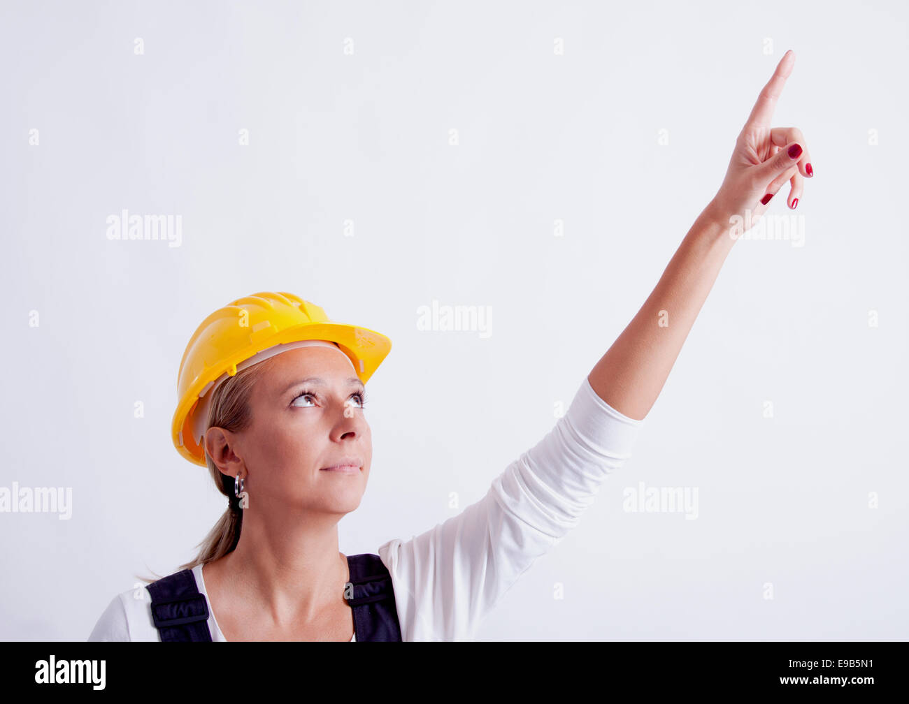 Female construction worker with tools on white background Stock Photo ...
