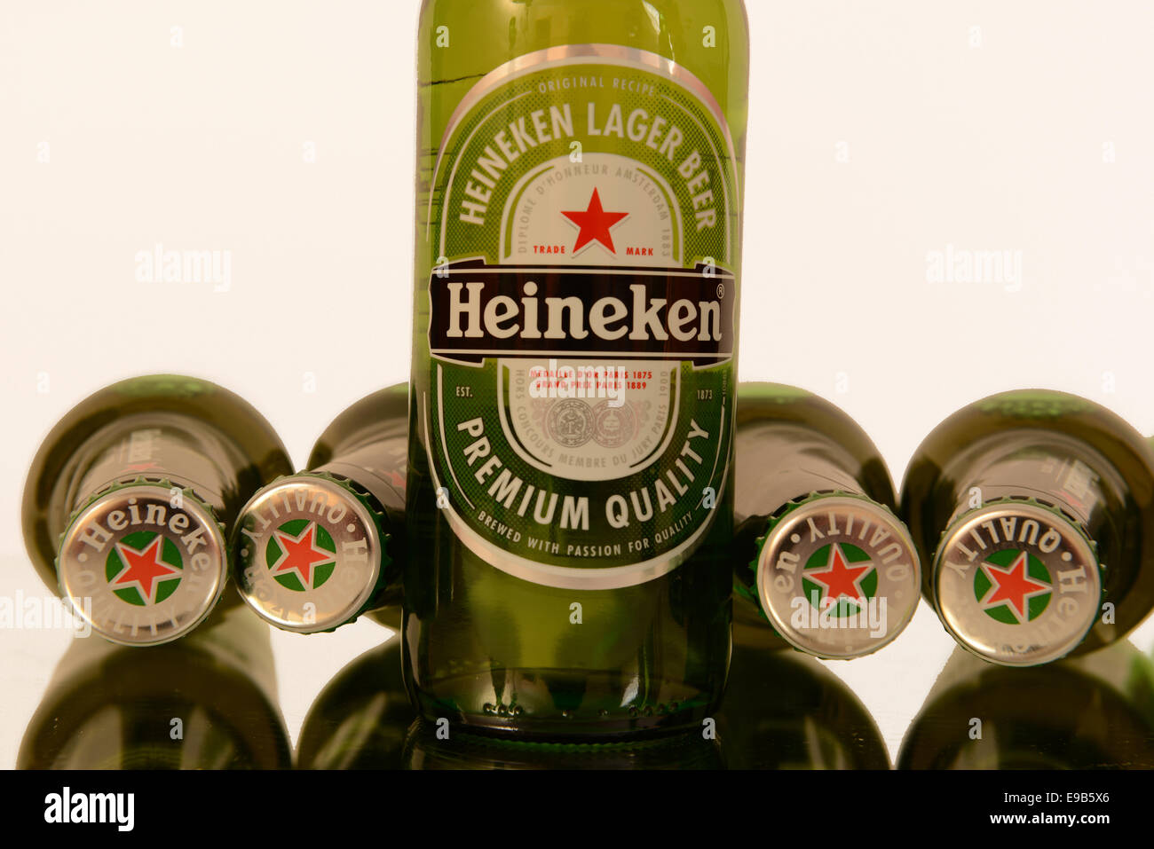 Bottle of Heineken standing upright with bottles lying flat Stock Photo