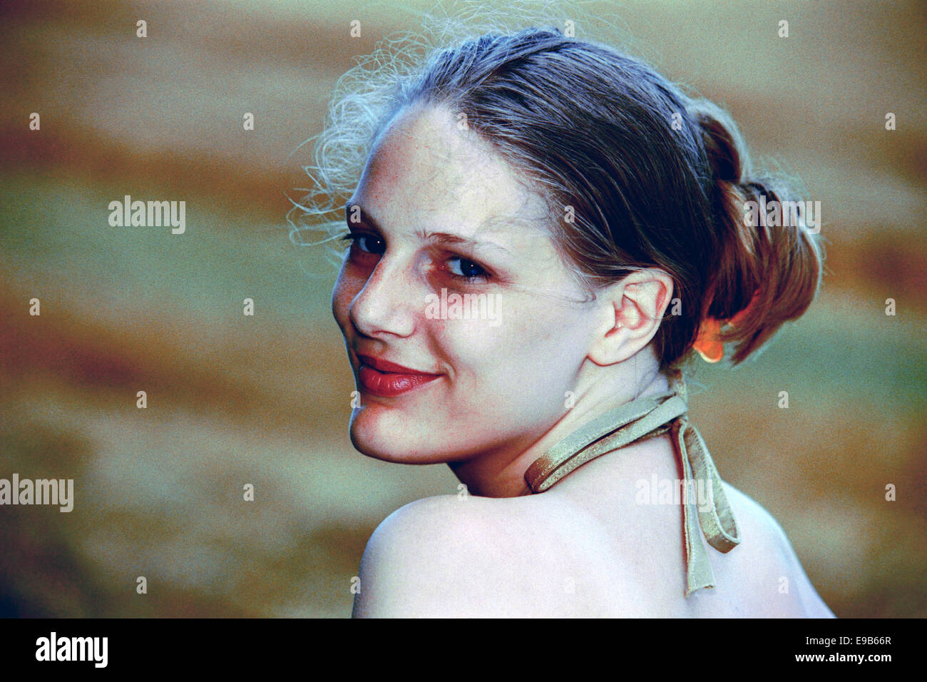 young female aspiring model poses for portfolio photographs during the