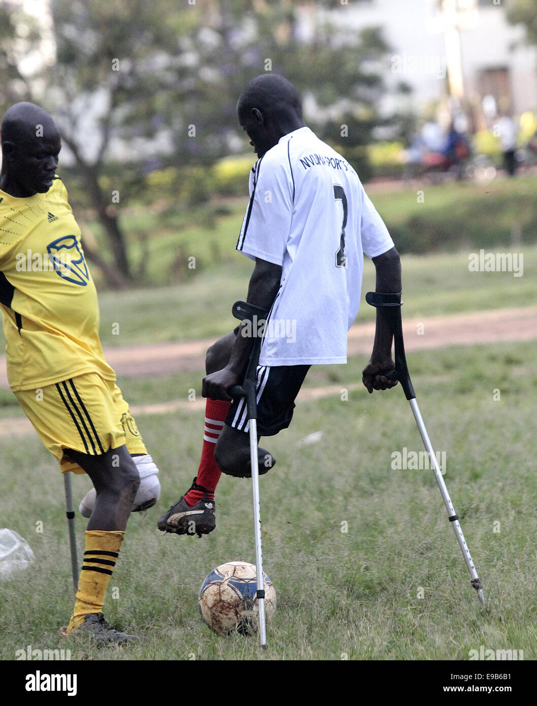 Kampala, Uganda. October 23rd, 2014. Ugandan amputees and disabled people take to soccer during the National Disabled Sports Gala at Kyambogo University sports ground. Disabled sport provides entertainment and recreation especially to former Ugandan soldier who lost some their limbs during the war between the Ugandan government and Joseph Kony led Lord’s Resistance Army (LRA). Credit:  Samson Opus/Alamy Live News Stock Photo
