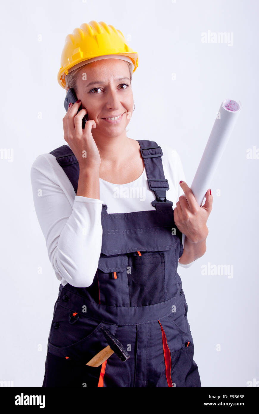 Female construction worker with tools on white background Stock Photo ...