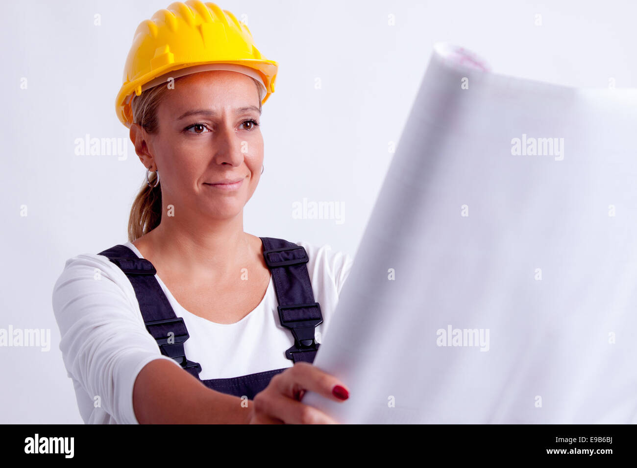 Female construction worker with tools on white background Stock Photo ...