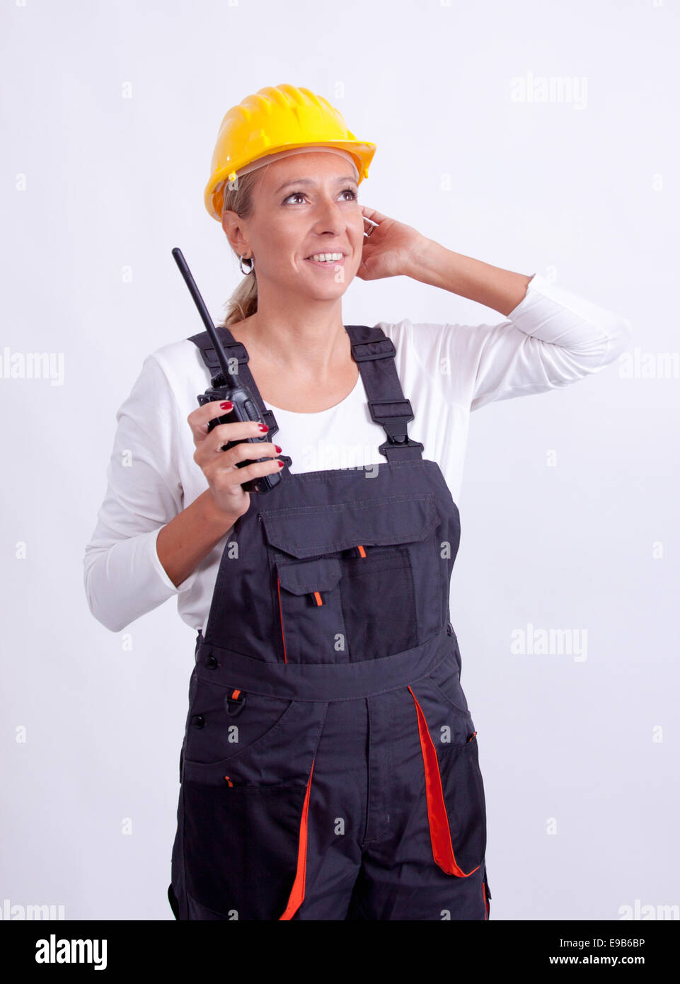 Female construction worker with tools on white background Stock Photo ...