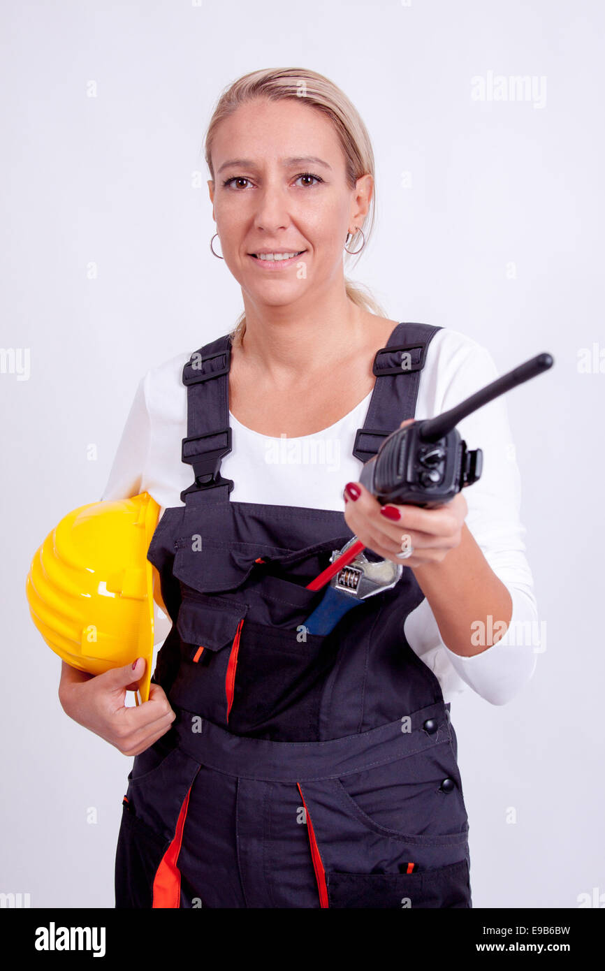 Female construction worker with tools on white background Stock Photo ...