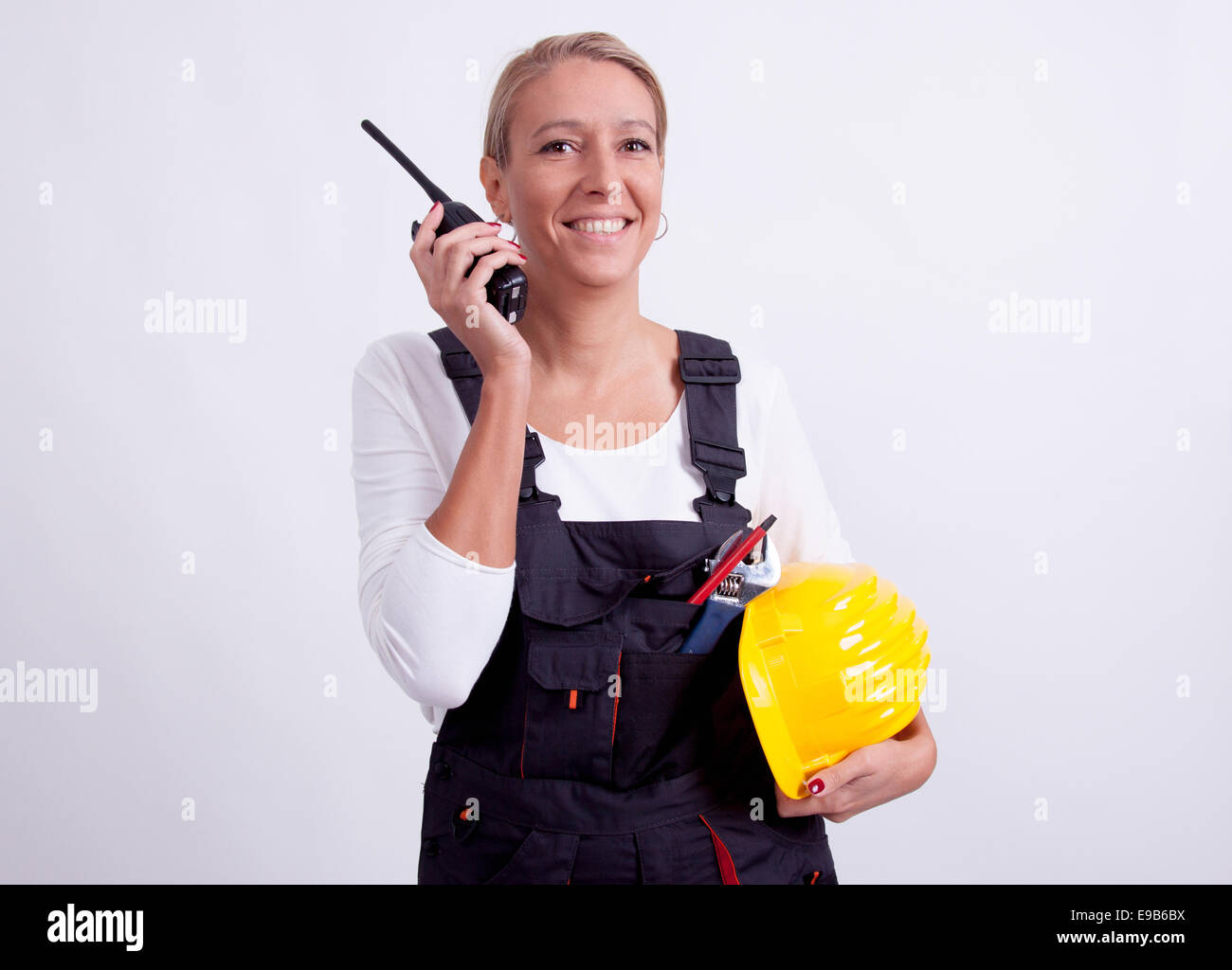 Female construction worker with tools on white background Stock Photo ...
