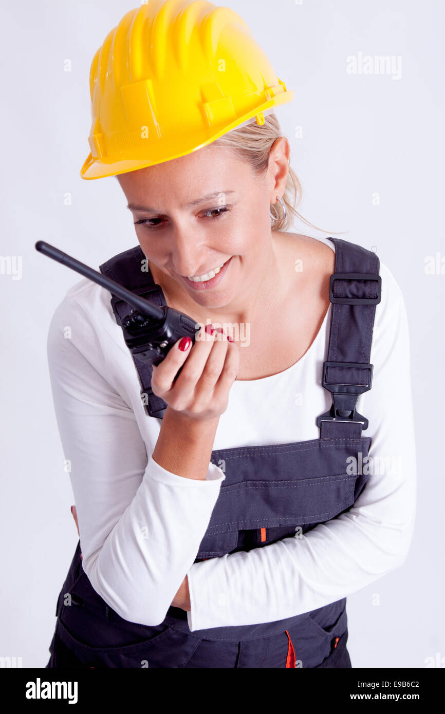 Female construction worker with tools on white background Stock Photo ...